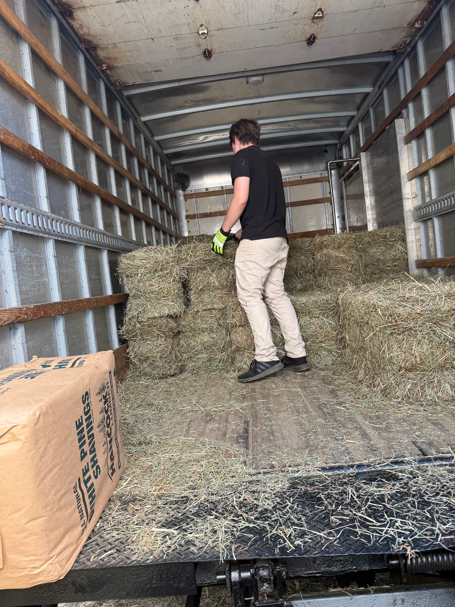 Delivering and stacking hay
